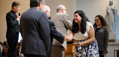 Woman receiving her diploma