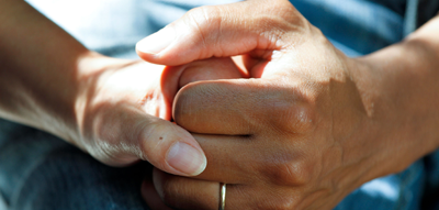 Couple clasping hands 2