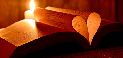 Open Bible with candle