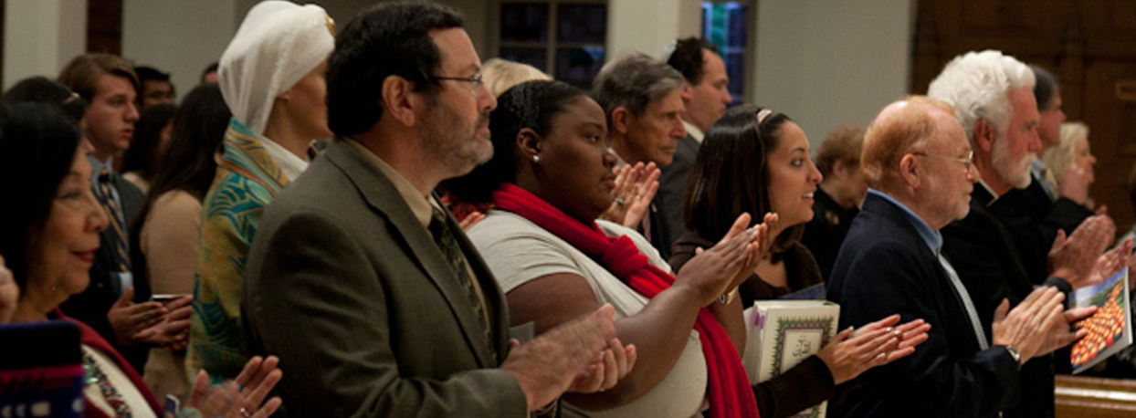 The diverse community gathers in worship and prayer