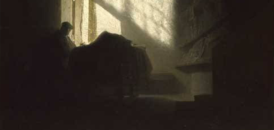 Man praying in shadow